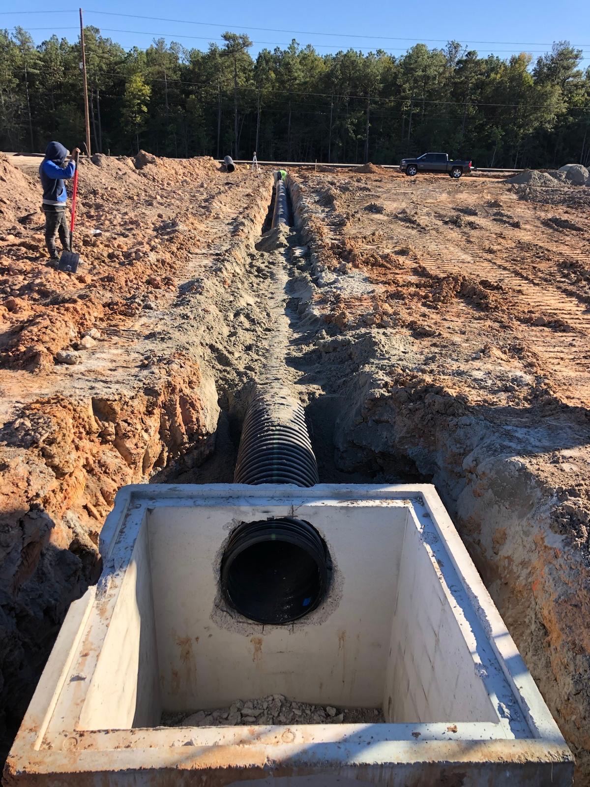 Precision crew installing drainage
